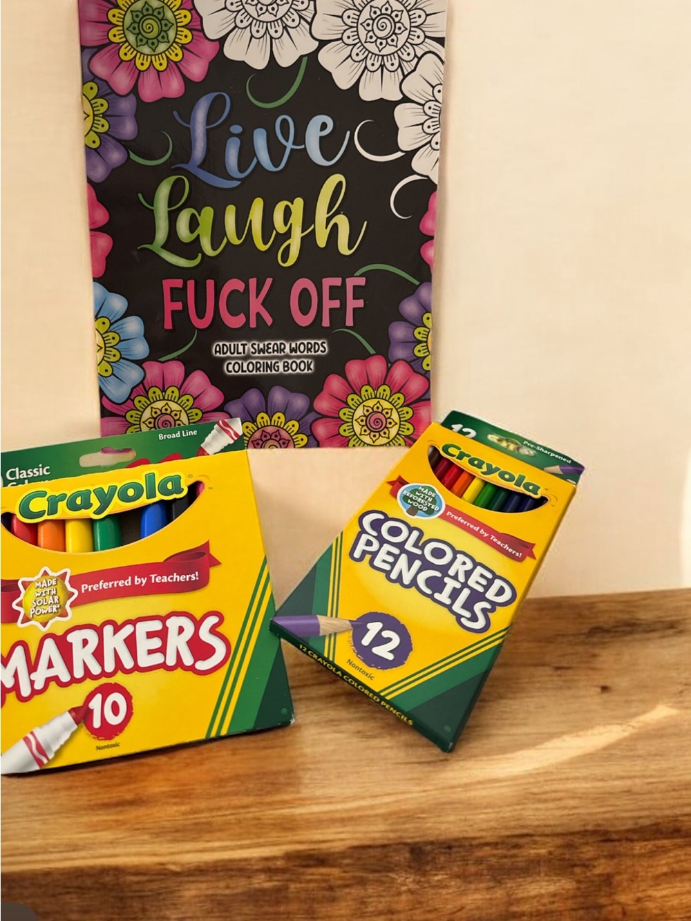 Adult coloring book withCrayola Colored Pencils & Markers Set
